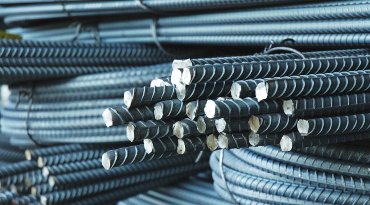 Stacked iron billets in a global steel trading warehouse
